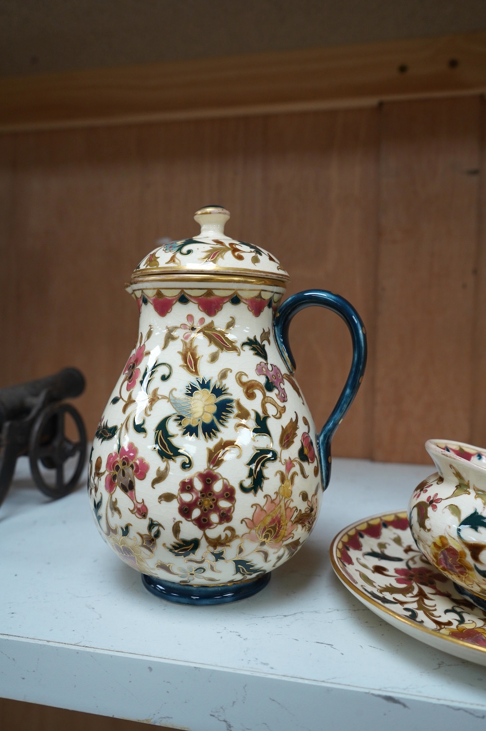 Four pieces of Zsolnay tableware in ‘Persian’ style, tallest 17cm. Condition - crazed but good